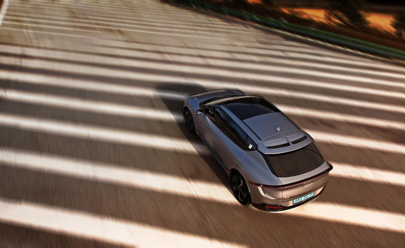 Hyundai EV cruising on road.