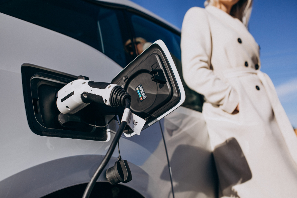 Woman charging EV