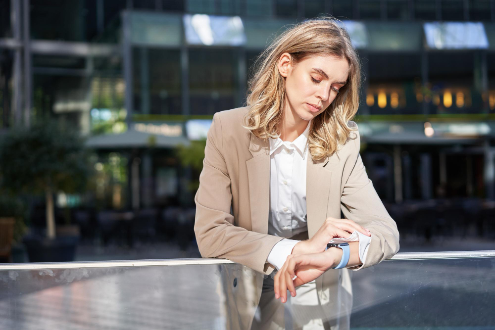 Woman waiting till EV is charged